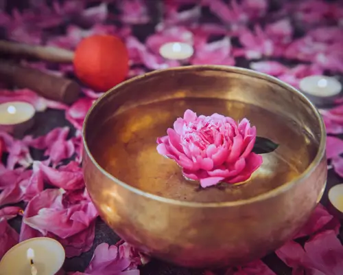 copper bronze singing bowl with a peony floating sound healing sound bath for mental health